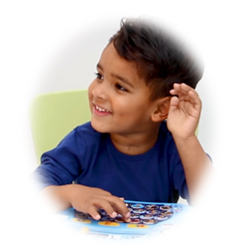 Young Boy Listening to the Thomas & Friends Alphaphonics™ Tablet